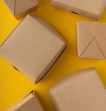 Plastic boxes for food delivery on bright background